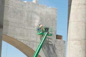 Concrete finisher at work on surface of bridge anchor. #1