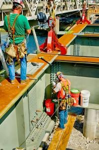 Ironworkers George Nichols and Zach Williams at work assembling another section of the Downtown Span on the Ohio River Bridges Project in Louisville, KY. HDR Version